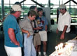 Picture of an FSEC researcher giving an explantion of how PV works to visitors.